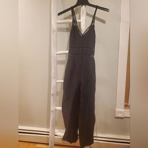 Express linen blend black jumpsuit with lace trim cross-back straps. NWT Size8